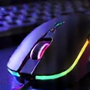 Ergonomic wireless gaming mouse, showing RGB lighting, clean background.